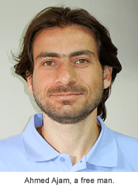 Head shot of Ahmed Ajam wearing a light blue shirt