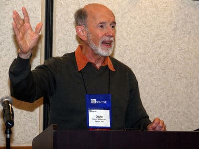 David Marshall raising his hand as he speaks at the WACDL's Annual 