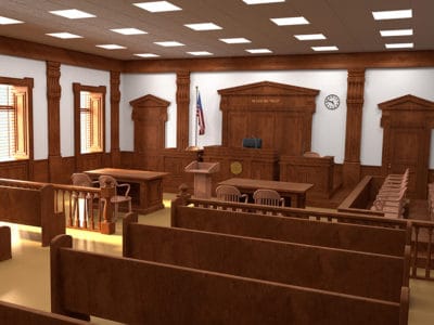 empty courtroom with brown benches and white walls