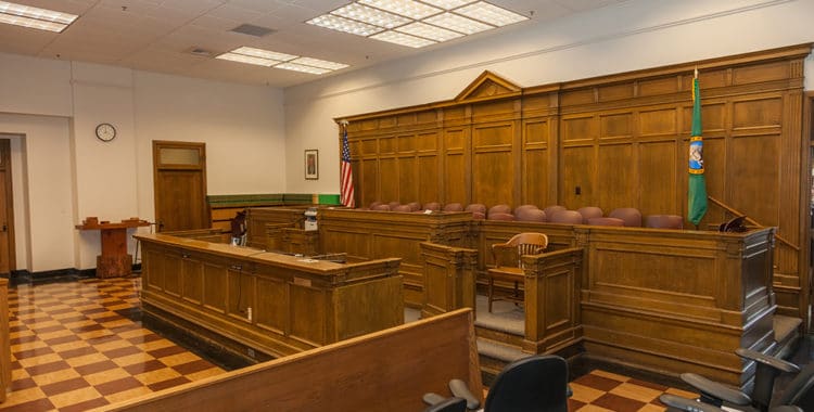 Empty courtroom focusing on jurors panel