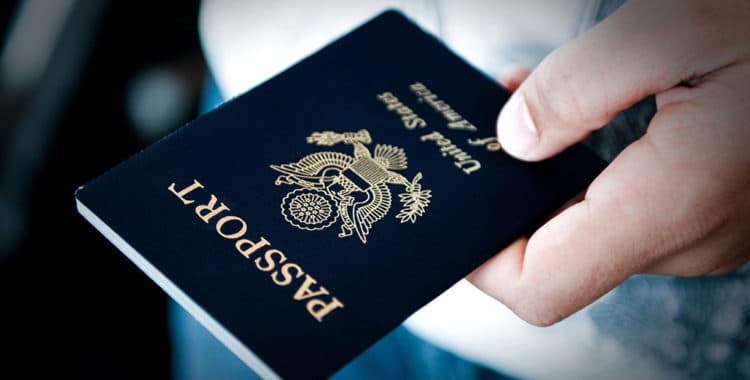 close-up of a person's hand holding a U.S. passport