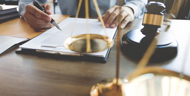 lawyer working with documents at a courtroom